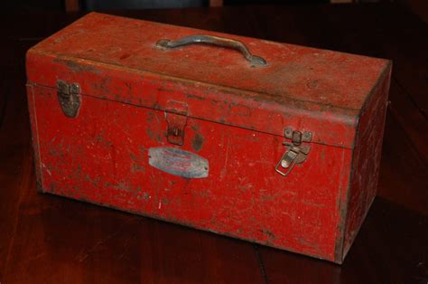 vintage red metal tool box|old fashioned tool box.